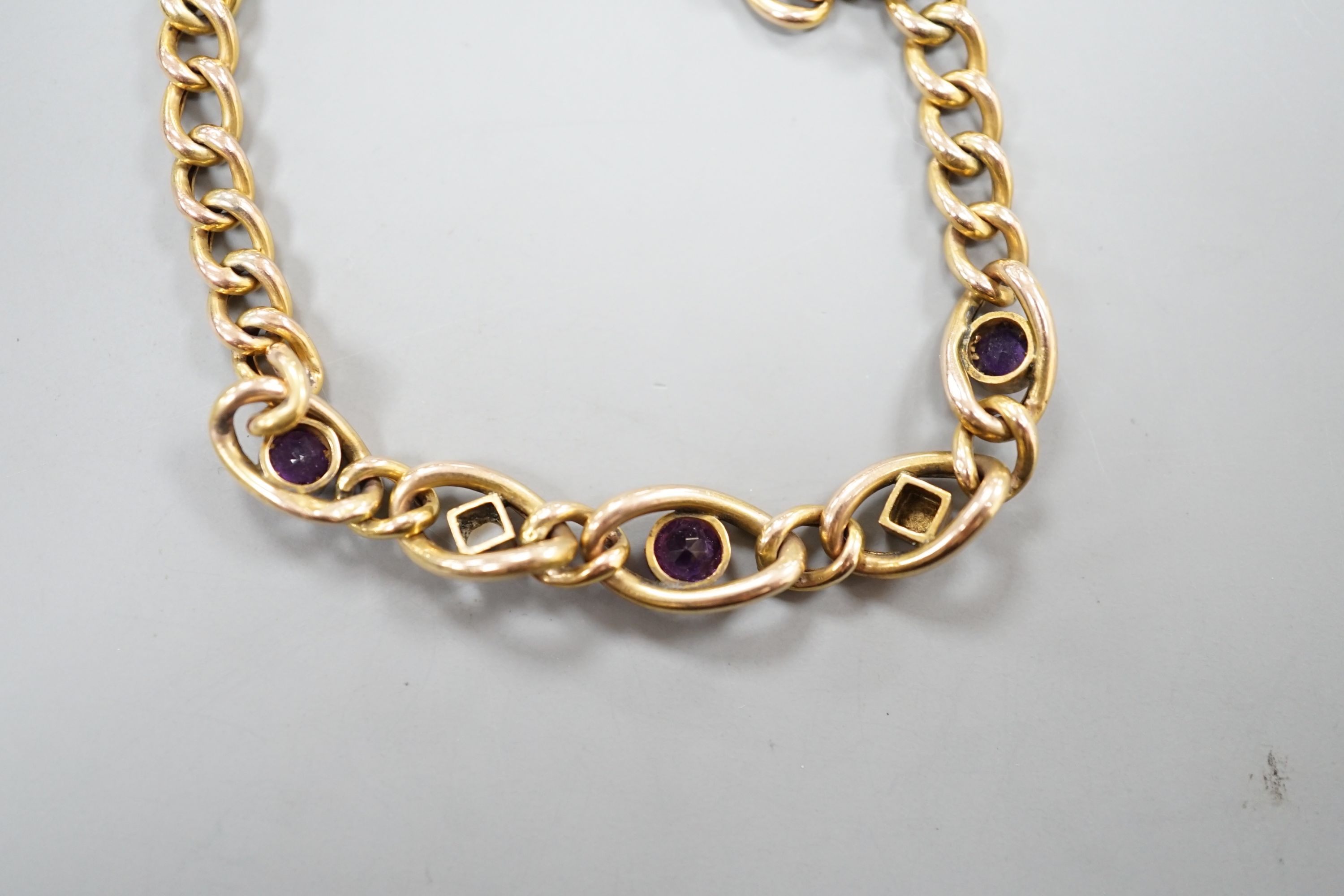 An Edwardian 9ct, amethyst and seed pearl set bracelet, 18cm, 6.1 grams.